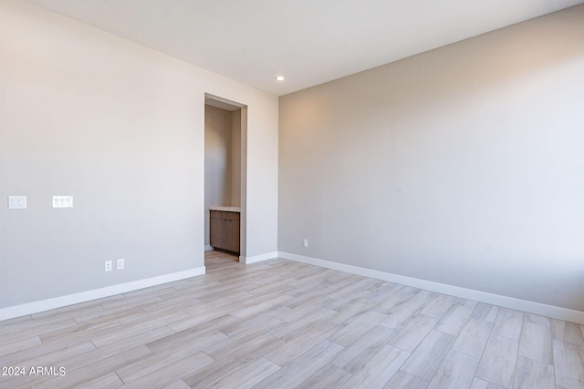 unfurnished room with light hardwood / wood-style floors