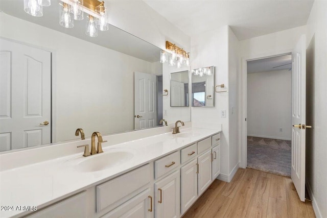 bathroom with vanity and hardwood / wood-style floors