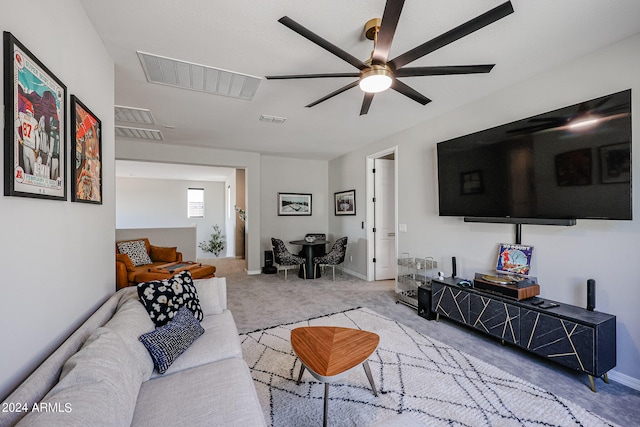 living room featuring light carpet and ceiling fan