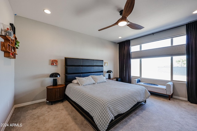 carpeted bedroom featuring ceiling fan