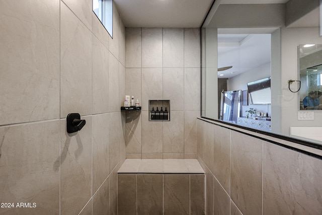 bathroom with tile walls