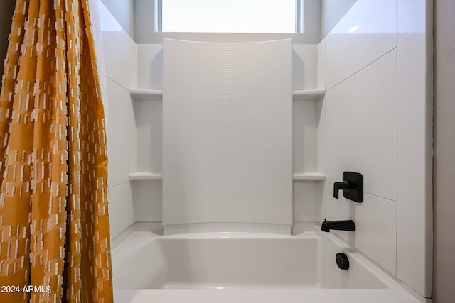 bathroom with shower / tub combo