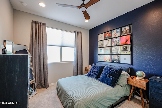 carpeted bedroom with ceiling fan