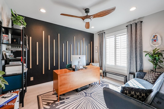 office area featuring light hardwood / wood-style flooring and ceiling fan