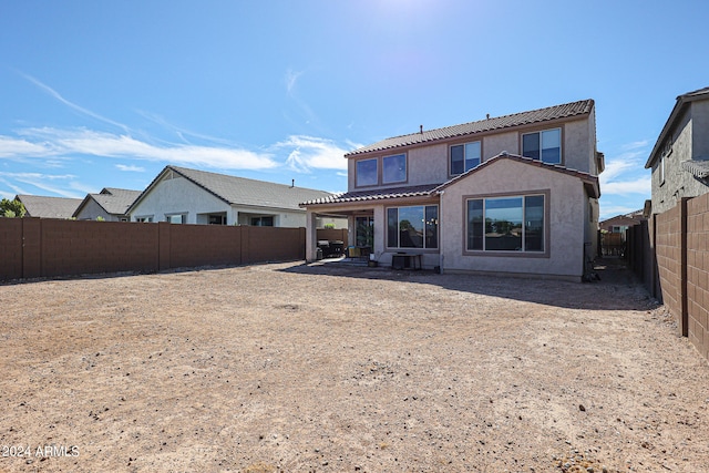 back of property with a patio area and a pergola