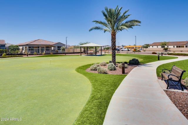 view of property's community featuring a yard and a gazebo