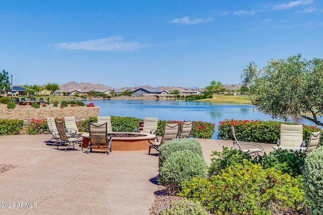 view of water feature with an outdoor fire pit