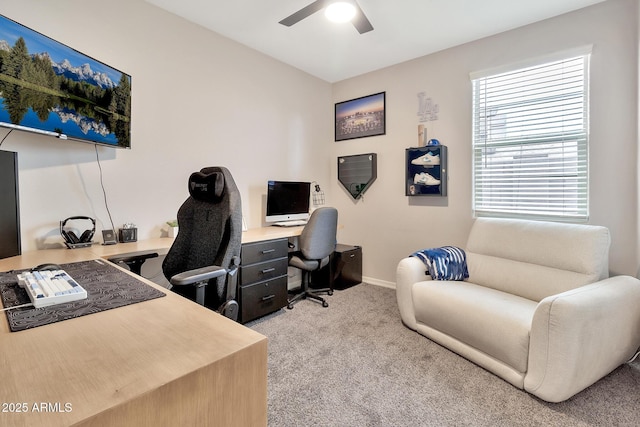 home office with ceiling fan, baseboards, and light colored carpet