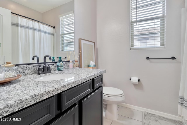 full bath with baseboards, vanity, toilet, and tile patterned floors