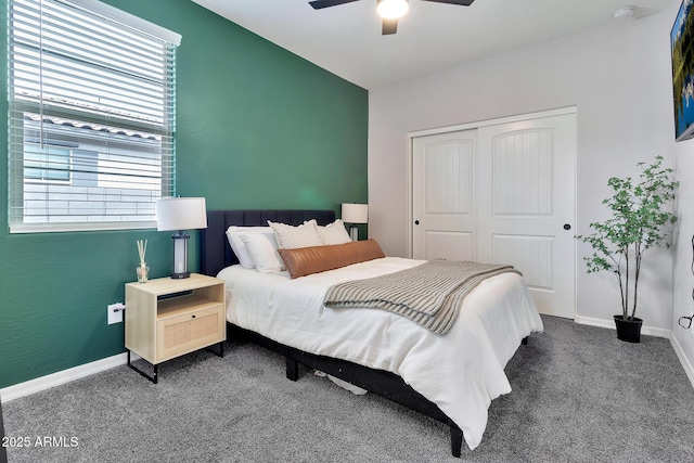 carpeted bedroom with a closet, a ceiling fan, and baseboards