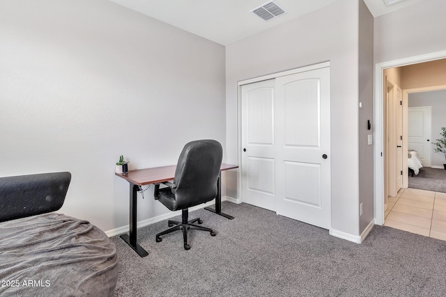 office featuring baseboards, visible vents, and carpet flooring