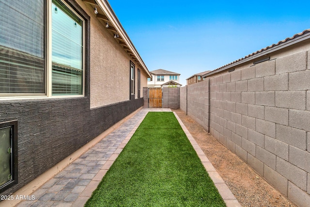 view of yard with a gate and fence