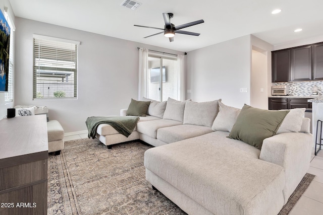 living room featuring recessed lighting, visible vents, light tile patterned flooring, ceiling fan, and baseboards