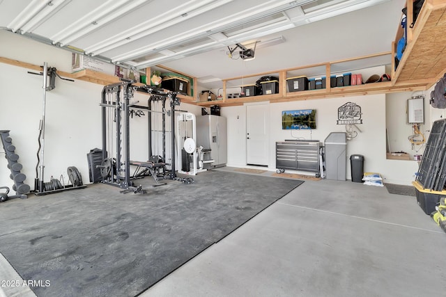 garage featuring refrigerator with ice dispenser and a garage door opener