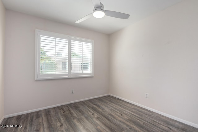 unfurnished room featuring dark hardwood / wood-style flooring and ceiling fan