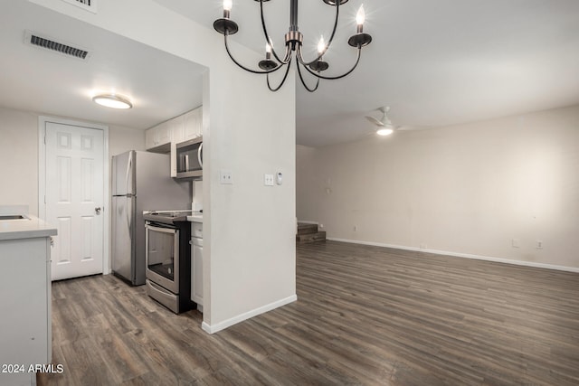 kitchen with appliances with stainless steel finishes, dark hardwood / wood-style floors, white cabinets, and ceiling fan