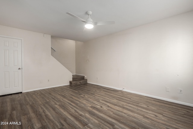 spare room with ceiling fan and dark hardwood / wood-style flooring