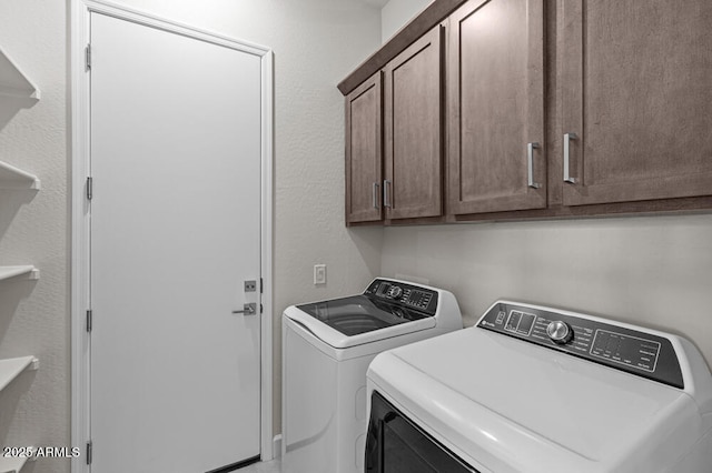 laundry area featuring cabinet space and washer and dryer