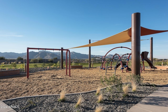 view of playground featuring a mountain view