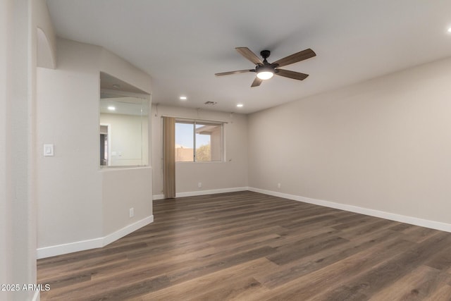 empty room with visible vents, dark wood-type flooring, ceiling fan, baseboards, and recessed lighting