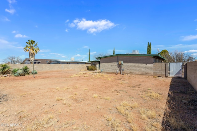 view of yard with a gate and fence