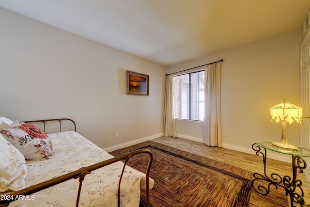 bedroom featuring hardwood / wood-style floors