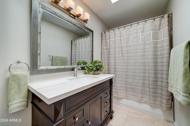 bathroom with vanity, shower / bathtub combination with curtain, and tile patterned floors