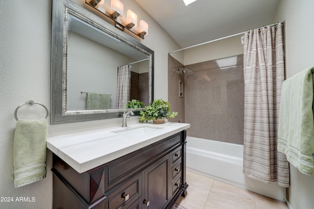 bathroom with shower / tub combo with curtain, tile patterned flooring, and vanity