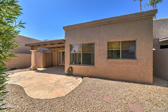 back of house with a patio