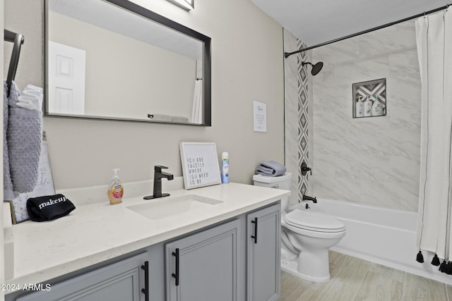 full bathroom featuring vanity, wood-type flooring, shower / tub combo, and toilet