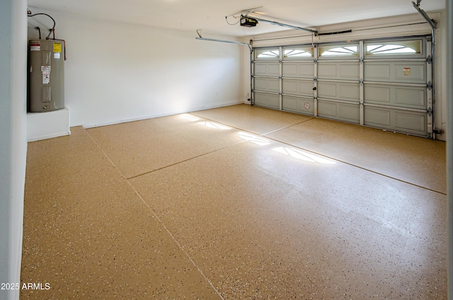 garage with a garage door opener and electric water heater