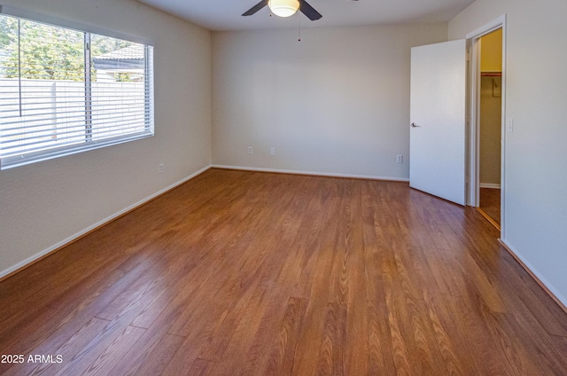 unfurnished room featuring hardwood / wood-style flooring and ceiling fan