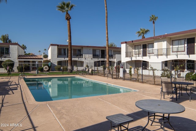 view of swimming pool with a patio