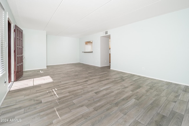 unfurnished room featuring light hardwood / wood-style floors