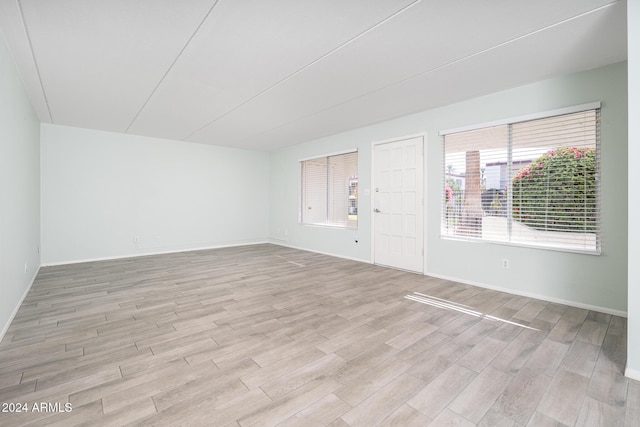 unfurnished room featuring light wood-type flooring