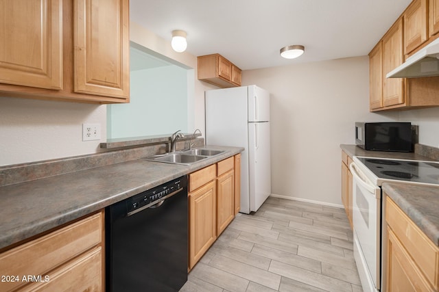 kitchen with white appliances, exhaust hood, sink, light brown cabinets, and light hardwood / wood-style flooring