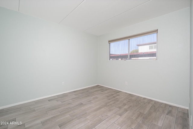unfurnished room featuring light hardwood / wood-style flooring