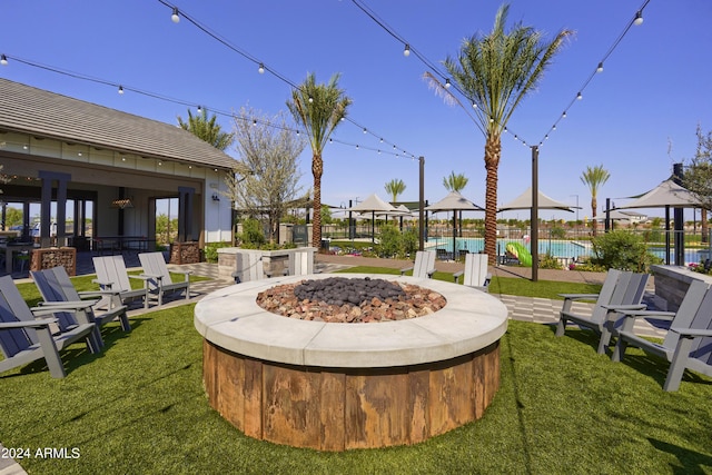 view of yard featuring a gazebo and a fire pit