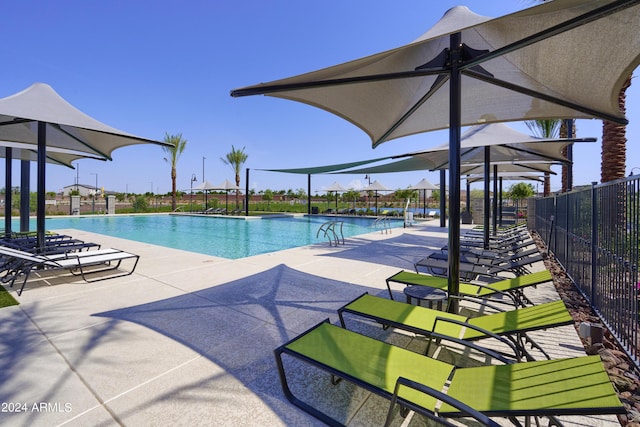 view of swimming pool with a patio