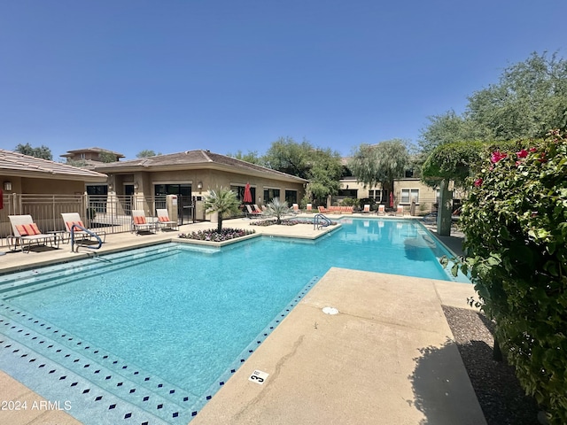 view of swimming pool with a patio area