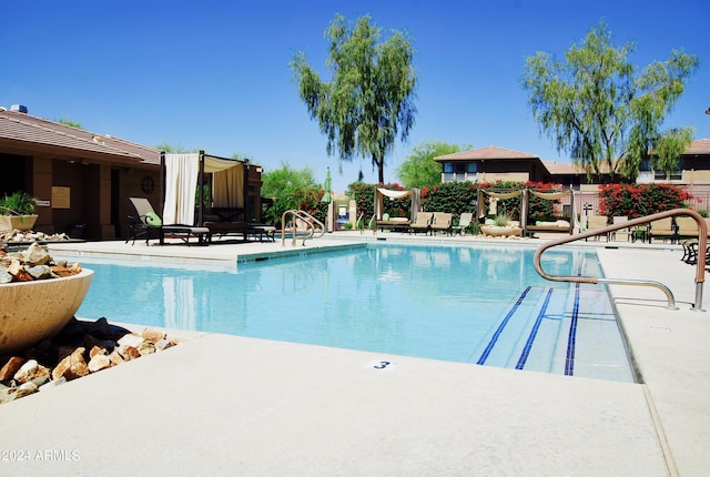 view of swimming pool with a patio