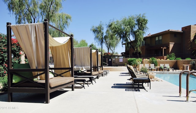 view of pool featuring a patio