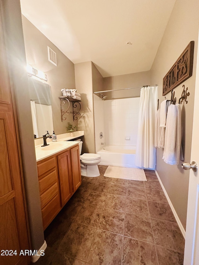 full bathroom with shower / tub combo, vanity, and toilet