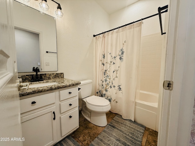 full bath featuring toilet, stone finish floor, shower / bath combo with shower curtain, and vanity