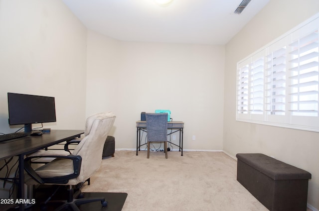 office space with light carpet, visible vents, and baseboards