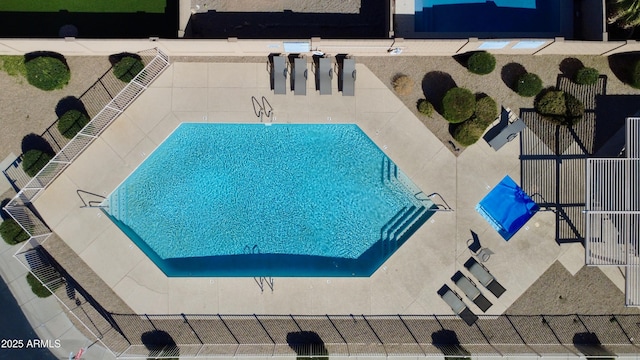 community pool featuring fence