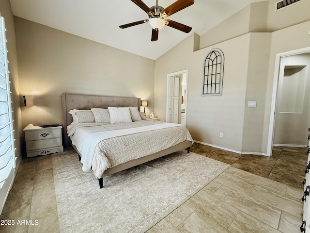 bedroom with high vaulted ceiling, a ceiling fan, visible vents, baseboards, and ensuite bath