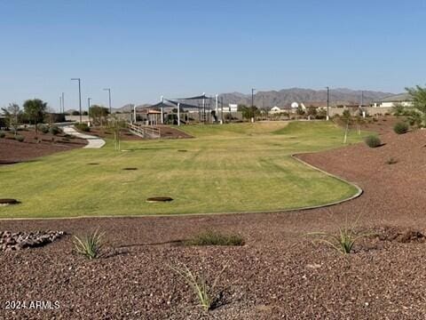 25484 W Graham Trl, Buckeye, AZ 85326 - view of community featuring a yard, a mountain view, and golf course view