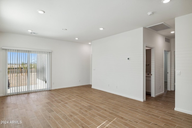 25484 W Graham Trl, Buckeye, AZ 85326 - spare room featuring light wood-style flooring, baseboards, and recessed lighting