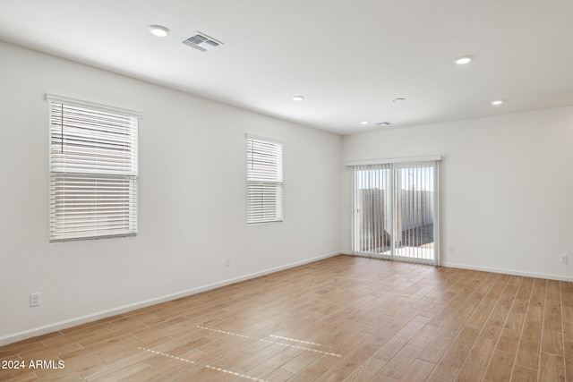 25484 W Graham Trl, Buckeye, AZ 85326 - unfurnished room featuring light wood finished floors, baseboards, and recessed lighting